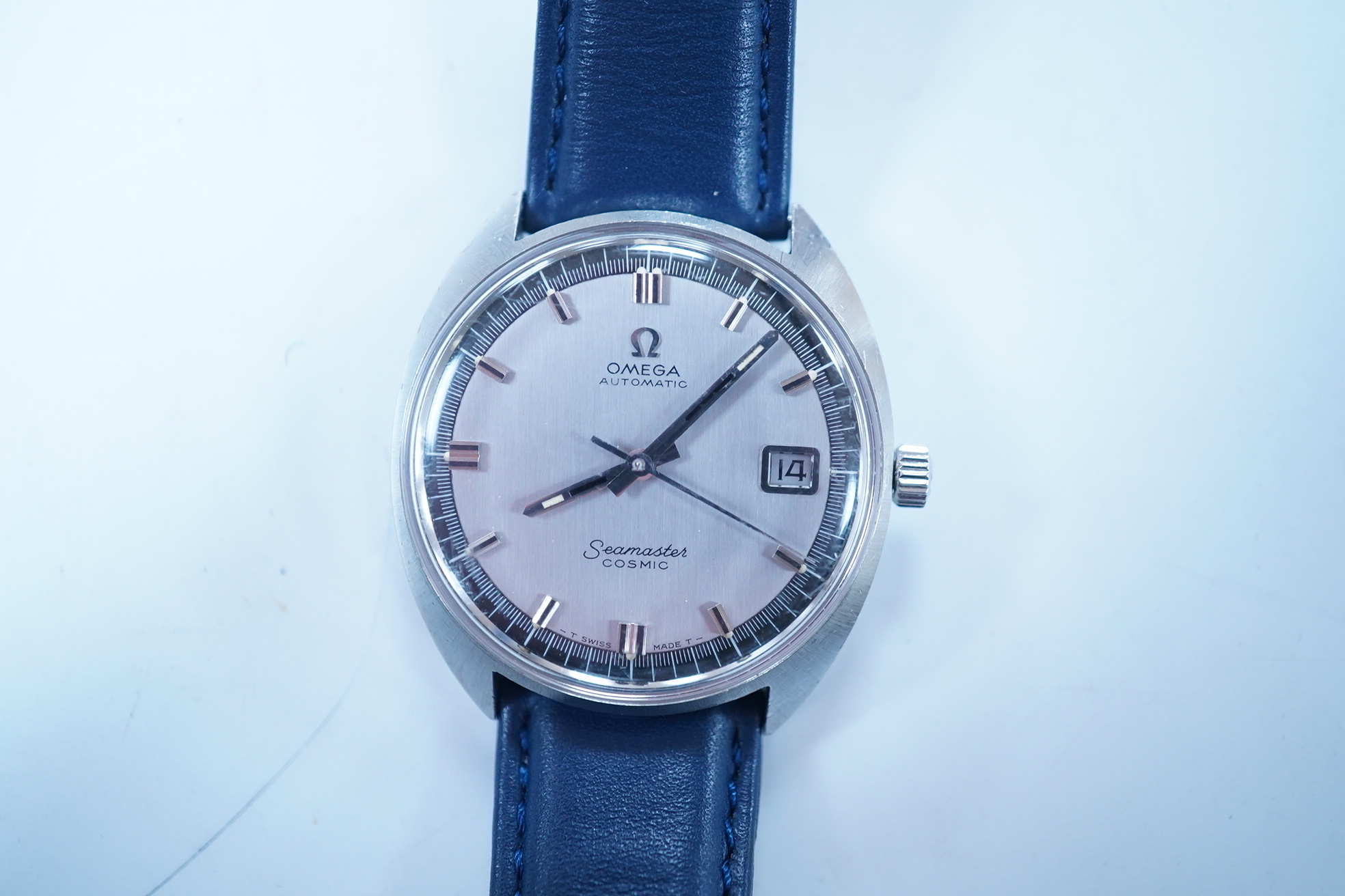 A gentleman's stainless steel Omega Seamaster Cosmic Automatic wrist watch, with baton numerals and date aperture, case diameter 35mm, on a later associated leather strap. Condition - fair